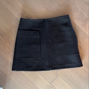 COS skirt with front pocket. Zip up back. Size 8.